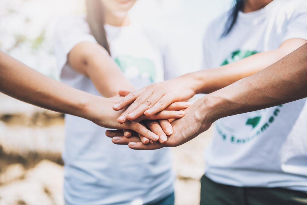 Care team hands together